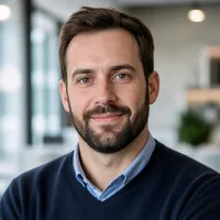 Professional author portrait for Chicken Road website, showing a trustworthy, intelligent adult in smart casual attire with a